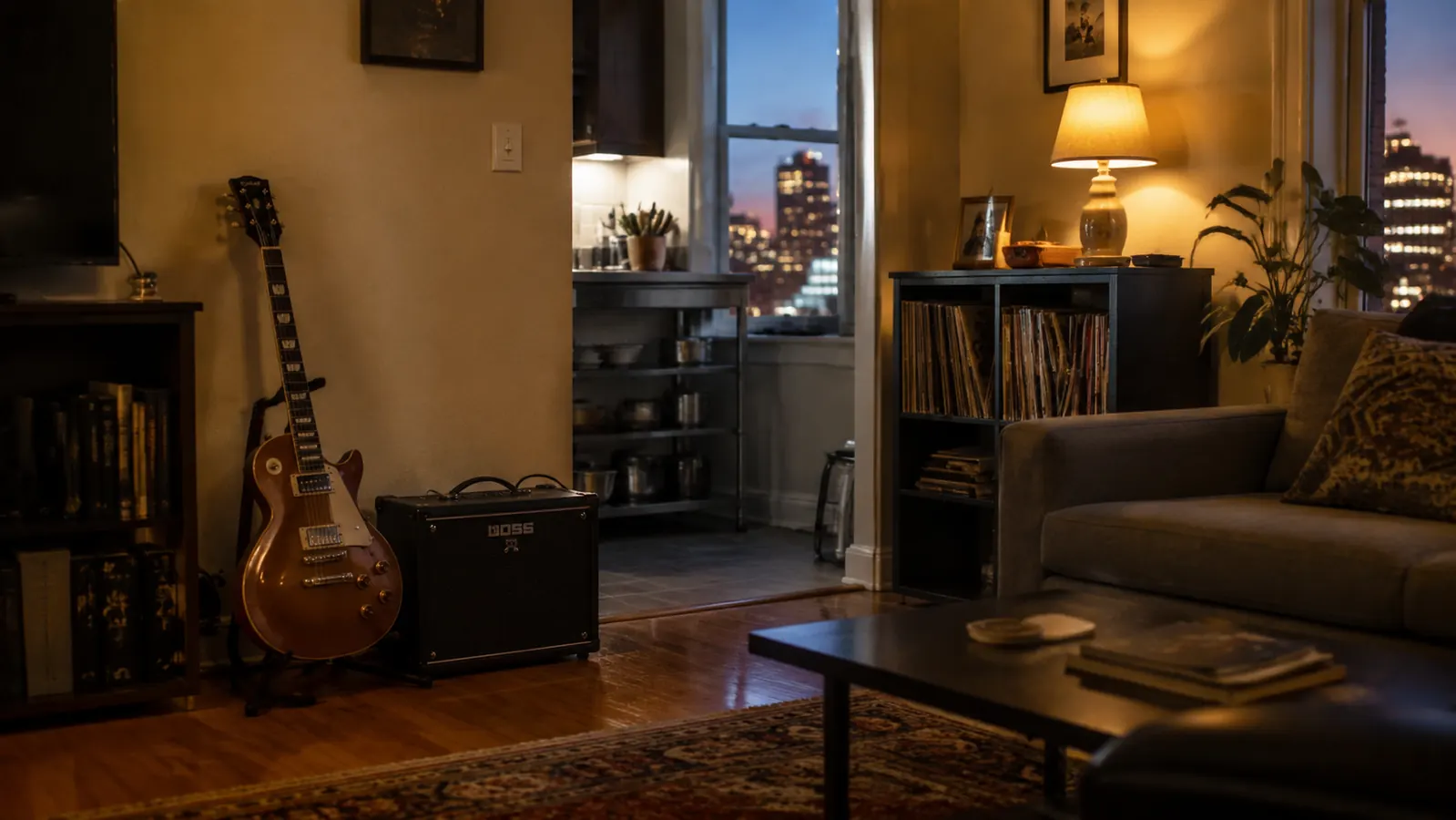 Small apartment living room with electric guitar leaning against a compact combo amp, warm evening light coming through a window